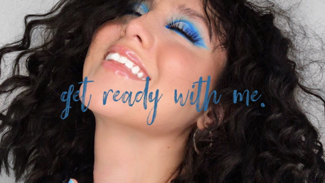 a very blue makeup look.