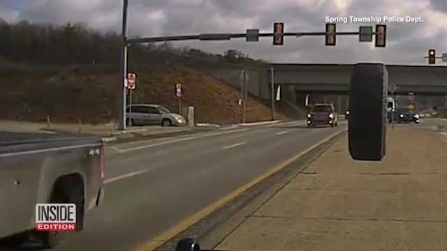 Flying Tire Smashes Police Cruiser Windshield