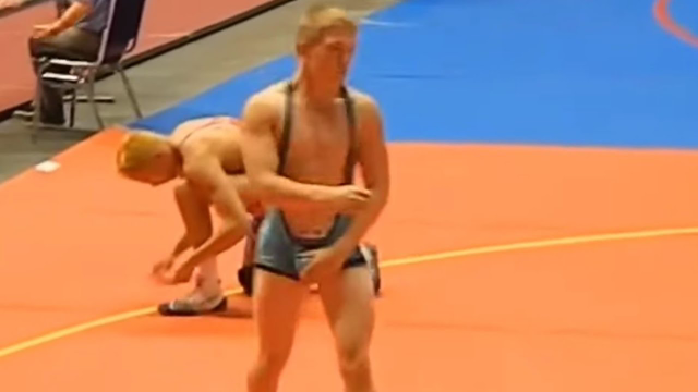 Wrestling in a low cut singlet